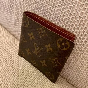 Authentic Louis Vuitton Men’s Vintage Leather Monogram wallet with snap pouch.